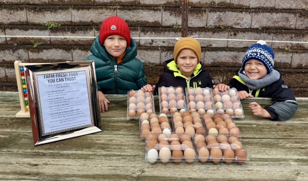 Children displaying farm-fresh pasture-raised eggs at Marlboro Meadows Farm Marlboro NJ