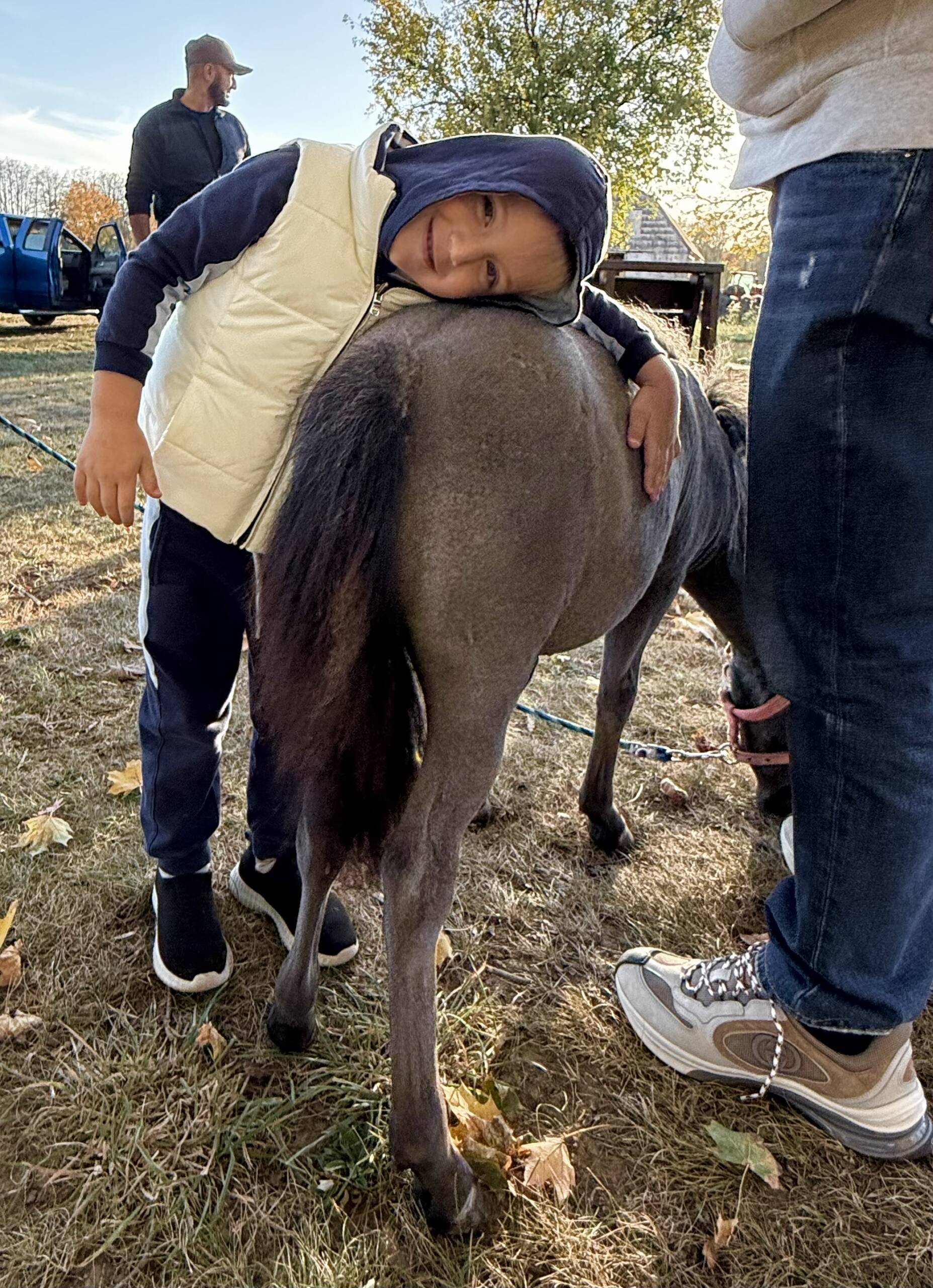 Samuel leaning on horse Hermes at Marlboro Meadows Farm NJ